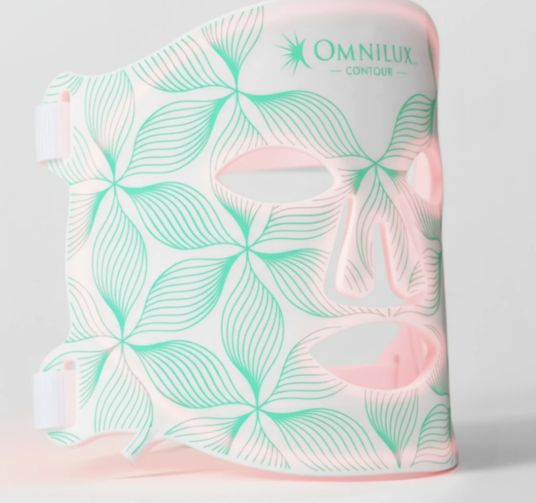 Omnilux Contour LED light therapy mask with floral design.