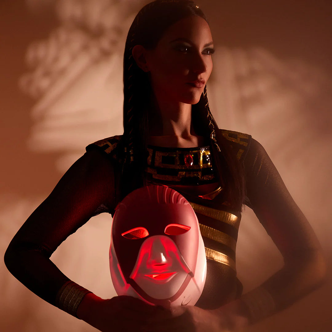 Cleolight LED mask glowing red, Cleopatra-inspired branding highlighting advanced skincare benefits.